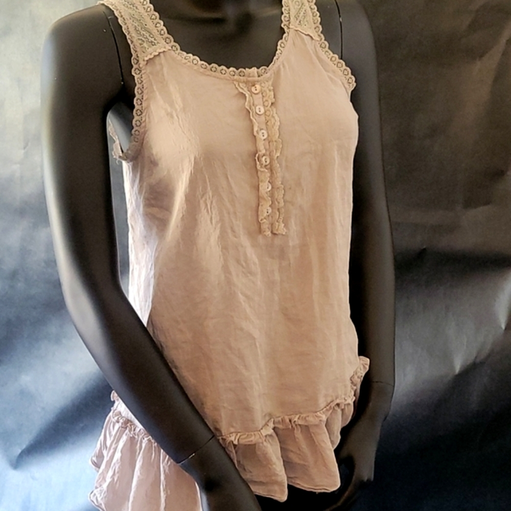 XXI sleeveless shirt small/petite light beige with ruffle botto.